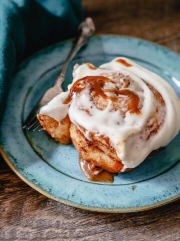 The famous, viral TikTok Cinnamon Rolls with heavy cream are even better than Cinnabon! These TikTok Cinnamon Rolls made with canned cinnamon rolls, a homemade buttery cinnamon drizzle, and a cream cheese frosting are the easiest cinnamon rolls you will ever make! 