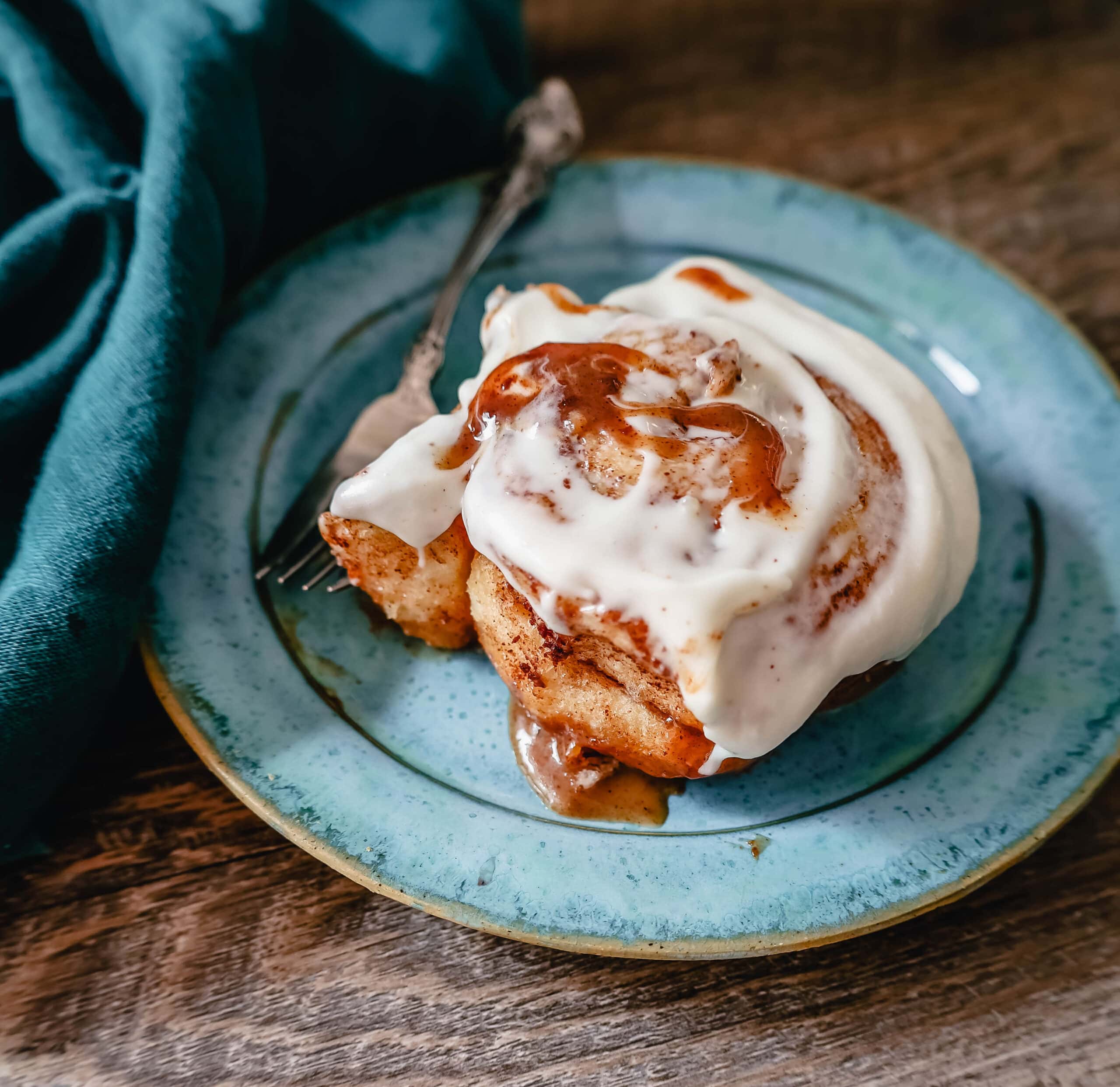 The famous, viral TikTok Cinnamon Rolls with heavy cream are even better than Cinnabon! These TikTok Cinnamon Rolls made with canned cinnamon rolls, a homemade buttery cinnamon drizzle, and a cream cheese frosting are the easiest cinnamon rolls you will ever make! 