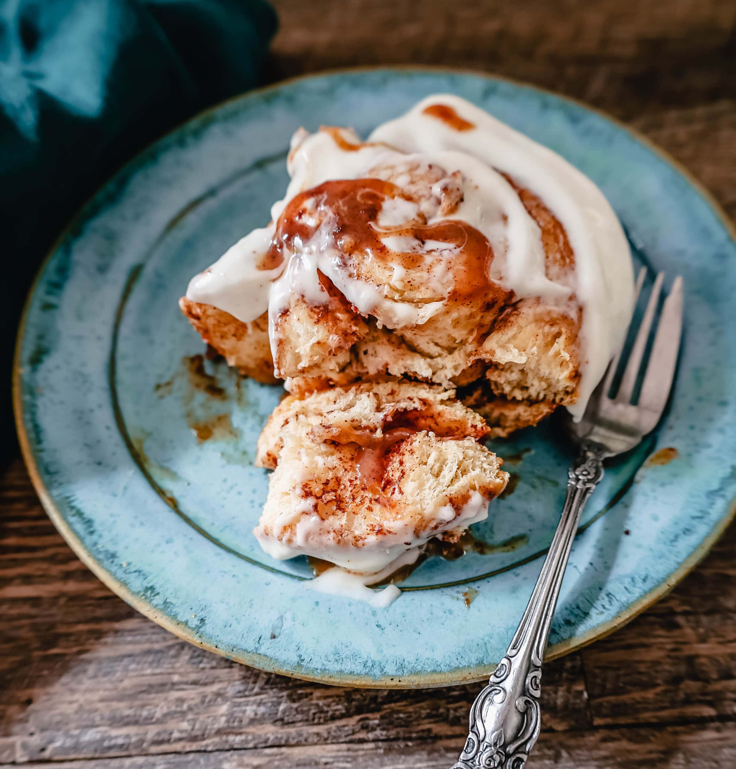 The famous, viral TikTok Cinnamon Rolls with heavy cream are even better than Cinnabon! These TikTok Cinnamon Rolls made with canned cinnamon rolls, a homemade buttery cinnamon drizzle, and a cream cheese frosting are the easiest cinnamon rolls you will ever make! 