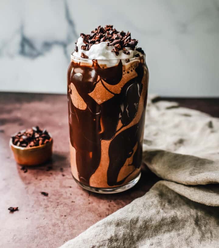 This Chocolate Almond Butter Smoothie is the richest, creamiest healthy chocolate protein shake made with almond butter. This tastes like a chocolate milkshake and you will forget you are drinking a chocolate protein shake!