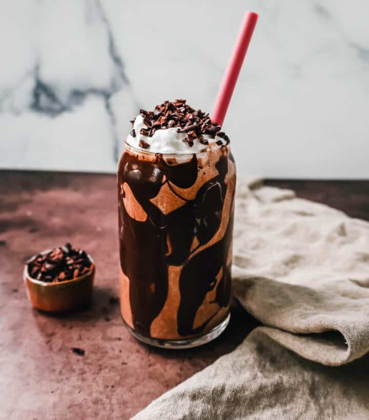 This Chocolate Almond Butter Smoothie is the richest, creamiest healthy chocolate protein shake made with almond butter. This tastes like a chocolate milkshake and you will forget you are drinking a chocolate protein shake!