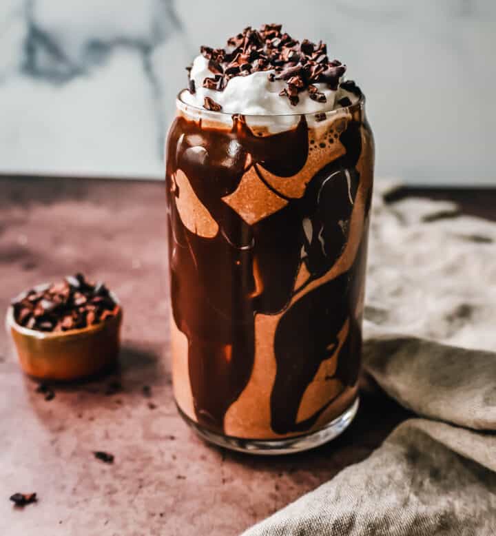 This Chocolate Almond Butter Smoothie is the richest, creamiest healthy chocolate protein shake made with almond butter. This tastes like a chocolate milkshake and you will forget you are drinking a chocolate protein shake!