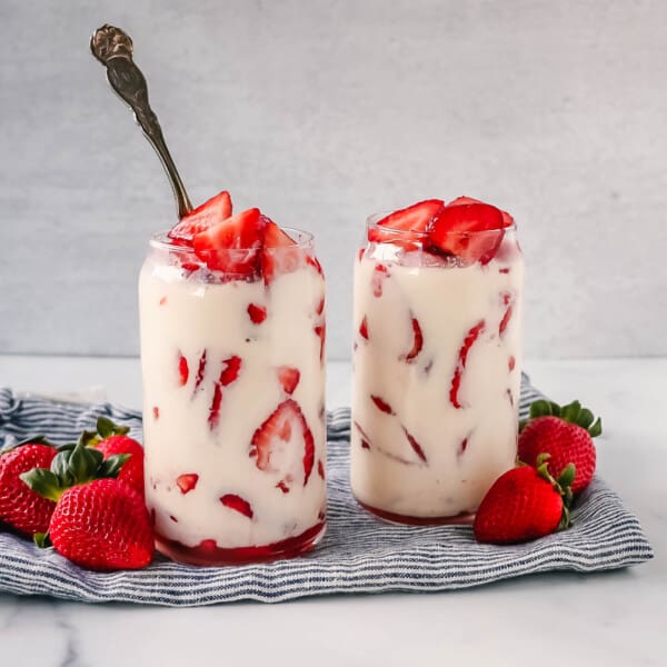 This Fresas con Crema is an authentic Mexican dessert made with fresh sliced Strawberries, Mexican Crema, Heavy Cream, and Sweetened Condensed Milk. This is the best Strawberries and Cream recipe!