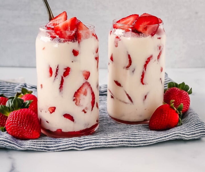 This Fresas con Crema is an authentic Mexican dessert made with fresh sliced Strawberries, Mexican Crema, Heavy Cream, and Sweetened Condensed Milk. This is the best Strawberries and Cream recipe!