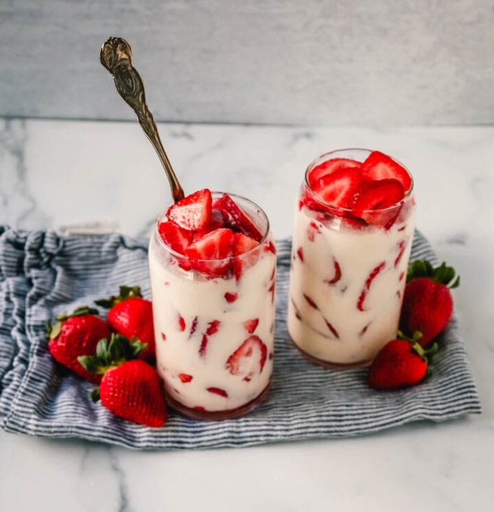 This Fresas con Crema is an authentic Mexican dessert made with fresh sliced Strawberries, Mexican Crema, Heavy Cream, and Sweetened Condensed Milk. This is the best Strawberries and Cream recipe!