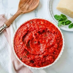 This Marinara Sauce is the best tomato sauce recipe! This San Marzano Tomato Sauce is made with extra-virgin olive oil, garlic, San Marzano canned tomatoes, tomato paste, fresh herbs, and spices. This homemade marinara sauce simmers for hours to create the most robust and flavorful easy marinara sauce.