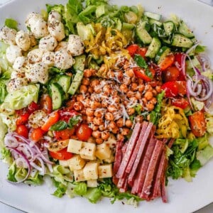 How to make the best Italian Chopped Salad made with Italian meats, cheeses, vegetables, and tossed with a homemade Italian dressing. This is the most flavor-packed salad recipe! This Italian Chop Salad is the perfect summer meal or side dish.