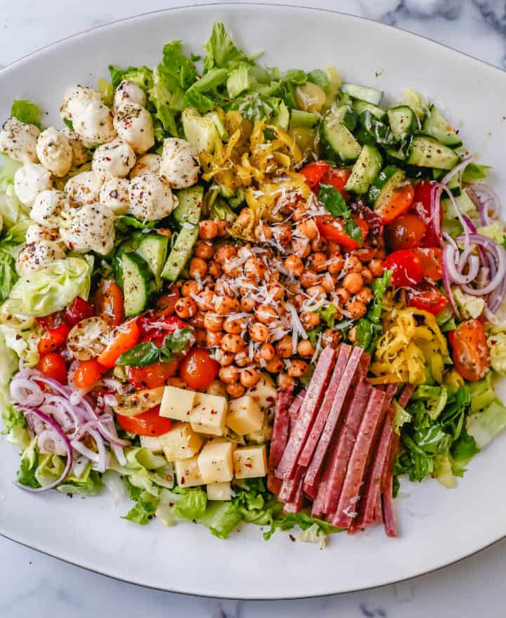 How to make the best Italian Chopped Salad made with Italian meats, cheeses, vegetables, and tossed with a homemade Italian dressing. This is the most flavor-packed salad recipe! This Italian Chop Salad is the perfect summer meal or side dish.