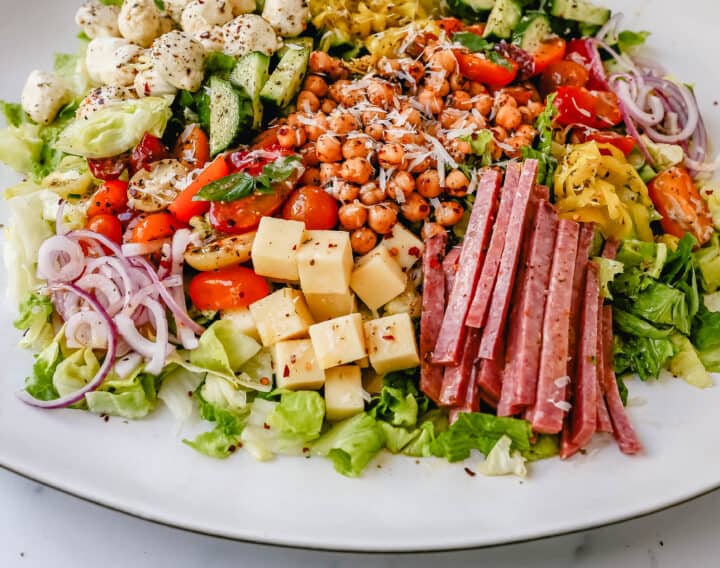 How to make the best Italian Chopped Salad made with Italian meats, cheeses, vegetables, and tossed with a homemade Italian dressing. This is the most flavor-packed salad recipe! This Italian Chop Salad is the perfect summer meal or side dish.