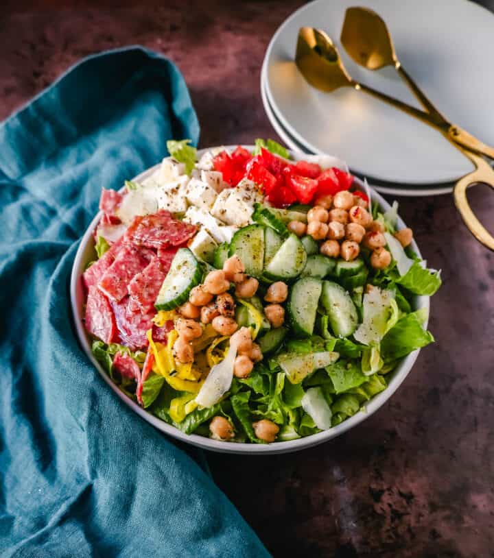 How to make the best Italian Chopped Salad made with Italian meats, cheeses, vegetables, and tossed with a homemade Italian dressing. This is the most flavor-packed salad recipe! This Italian Chop Salad is the perfect summer meal or side dish.