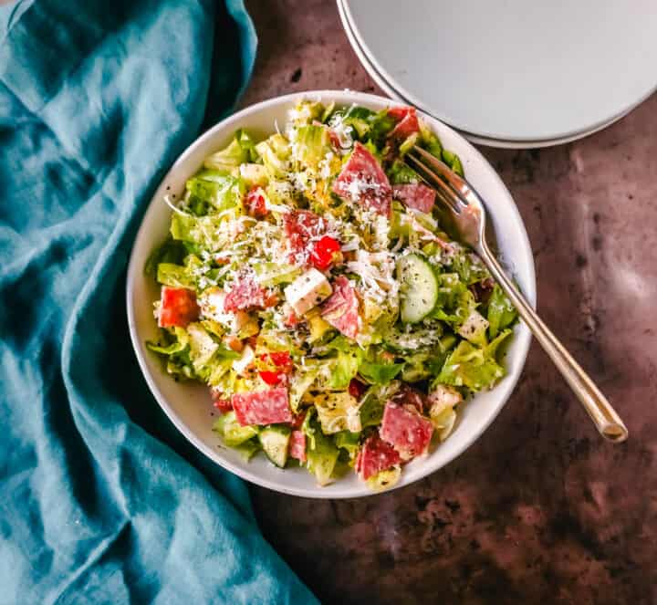 How to make the best Italian Chopped Salad made with Italian meats, cheeses, vegetables, and tossed with a homemade Italian dressing. This is the most flavor-packed salad recipe! This Italian Chop Salad is the perfect summer meal or side dish.