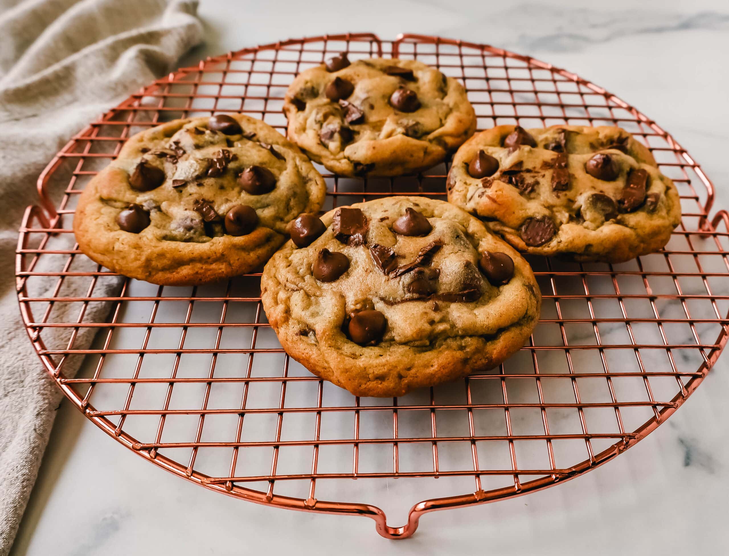 Thick, chewy milk chocolate chip cookies have the perfect chewy centers with a lot of melted chocolate and slightly crispy edges. The best milk chocolate chip cookie recipe!