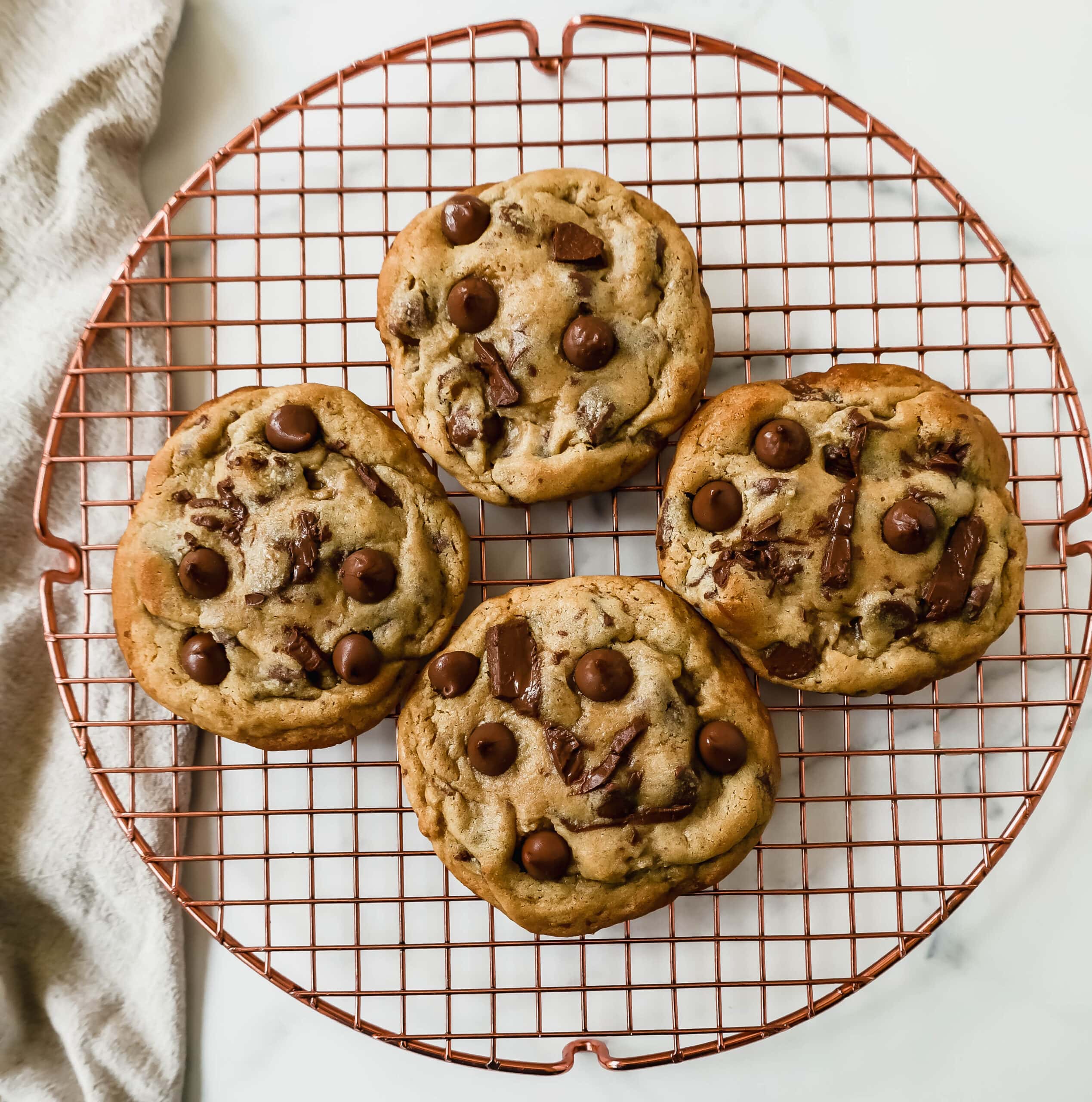 Thick, chewy milk chocolate chip cookies have the perfect chewy centers with a lot of melted chocolate and slightly crispy edges. The best milk chocolate chip cookie recipe!