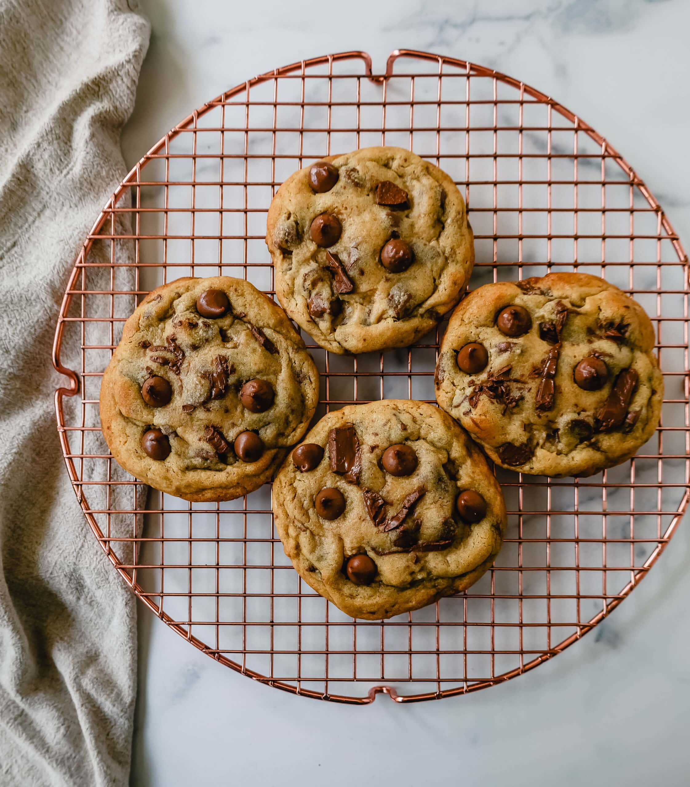 Thick, chewy milk chocolate chip cookies have the perfect chewy centers with a lot of melted chocolate and slightly crispy edges. The best milk chocolate chip cookie recipe!