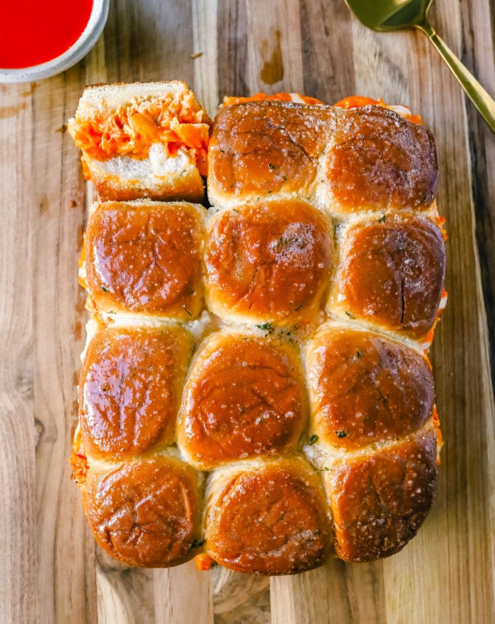 Buffalo Chicken Sliders are made with tender shredded chicken tossed in buffalo sauce and ranch dressing and baked inside a soft garlic butter bun with melted mozzarella cheese. The buffalo wing chicken sliders are perfect for watching football!