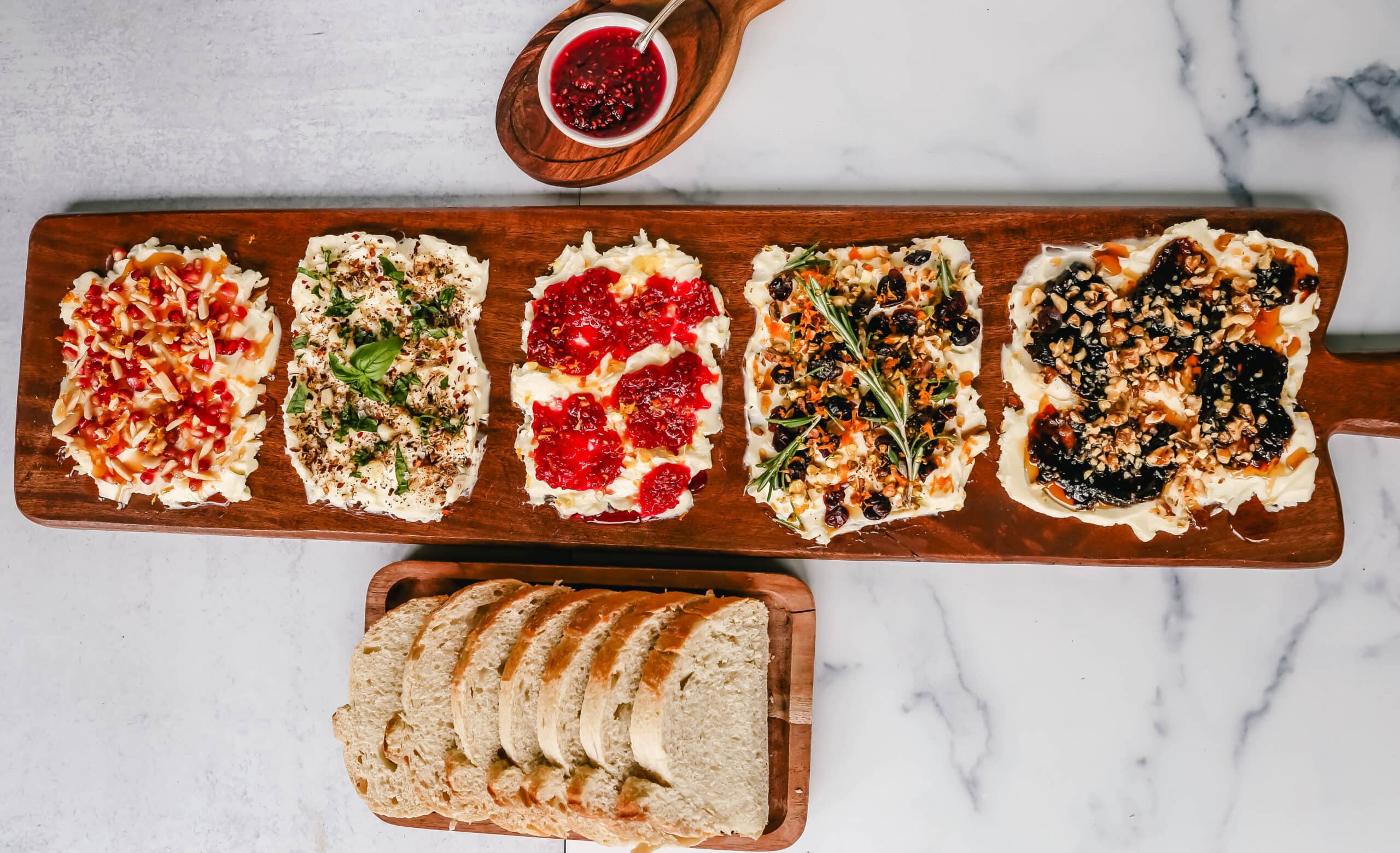  A Butter Board with fresh butter is spread onto a board and topped with an assortment of toppings and served with warm bread. This Butter Board with Toppings is such a fun appetizer for a party!