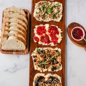  A Butter Board with fresh butter is spread onto a board and topped with an assortment of toppings and served with warm bread. This Butter Board with Toppings is such a fun appetizer for a party! A Butter Board is made by spreading salted, slightly softened butter onto a board and topping it with your favorite toppings like jam and fresh lemon zest and hot honey, walnuts, and fig jam. A savory butter board can be made with butter, roasted garlic, fresh basil, italian seasoning, and red chili flakes. Warm French bread slices are dipped into each savory or sweet butter combination.  This Butter Board became famous on TikTok and is now a popular appetizer at parties.