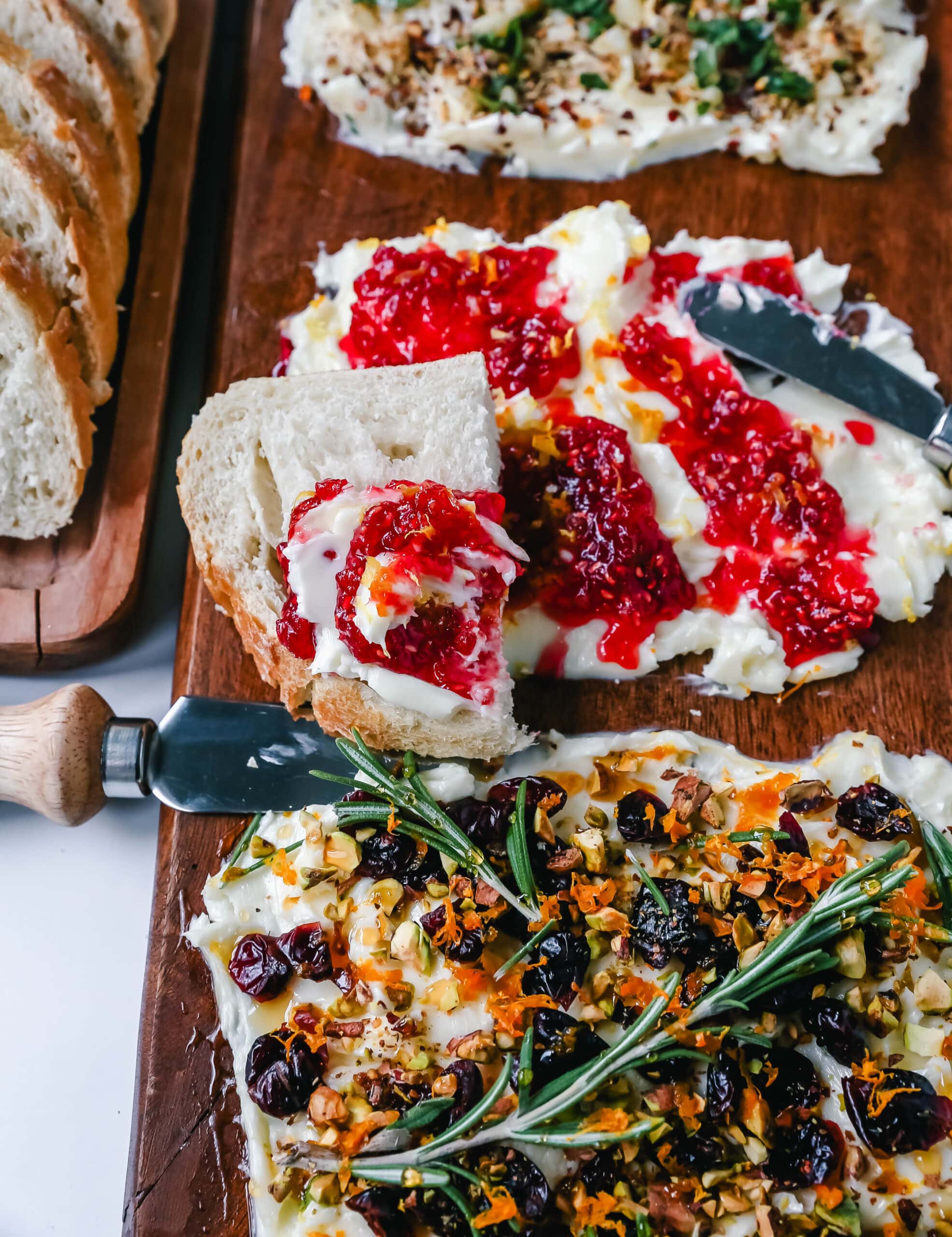  A Butter Board with fresh butter is spread onto a board and topped with an assortment of toppings and served with warm bread. This Butter Board with Toppings is such a fun appetizer for a party!