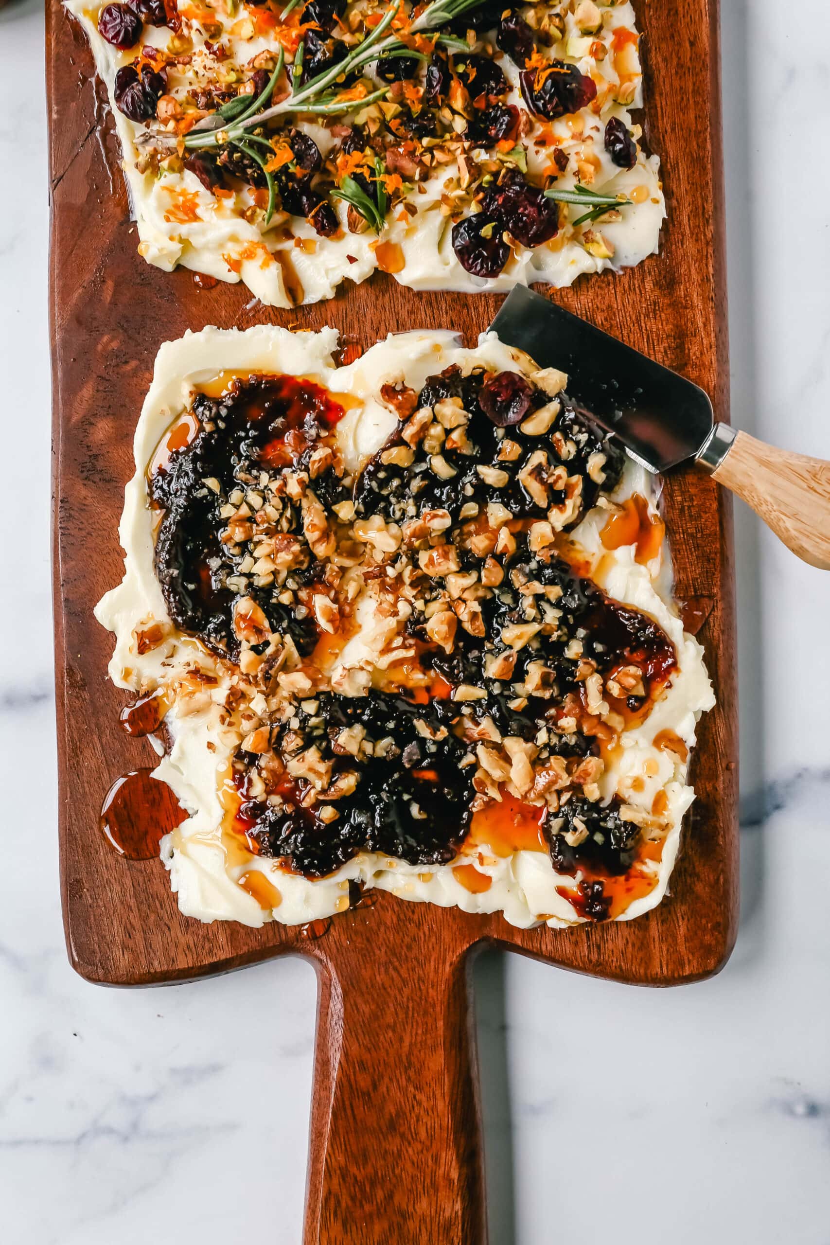  A Butter Board with fresh butter is spread onto a board and topped with an assortment of toppings and served with warm bread. This Butter Board with Toppings is such a fun appetizer for a party!