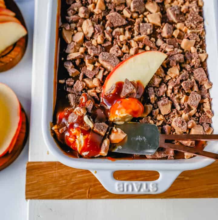 A 5-ingredient Caramel Apple Dip made with cream cheese, brown sugar, vanilla, caramel sauce, and Heath Bar toffee pieces. This is the perfect dip for fresh apples! This Caramel Toffee Dip is the easiest dessert to serve at parties.