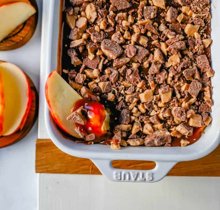 A 5-ingredient Caramel Apple Dip made with cream cheese, brown sugar, vanilla, caramel sauce, and Heath Bar toffee pieces. This is the perfect dip for fresh apples! This Caramel Toffee Dip is the easiest dessert to serve at parties.
