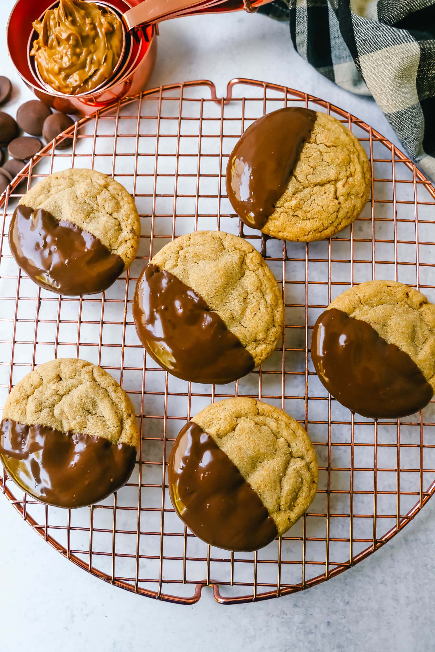 Soft, chewy homemade peanut butter cookies dipped in melted chocolate. This peanut butter and chocolate cookie is rich and decadent and perfect for chocolate peanut butter lovers!