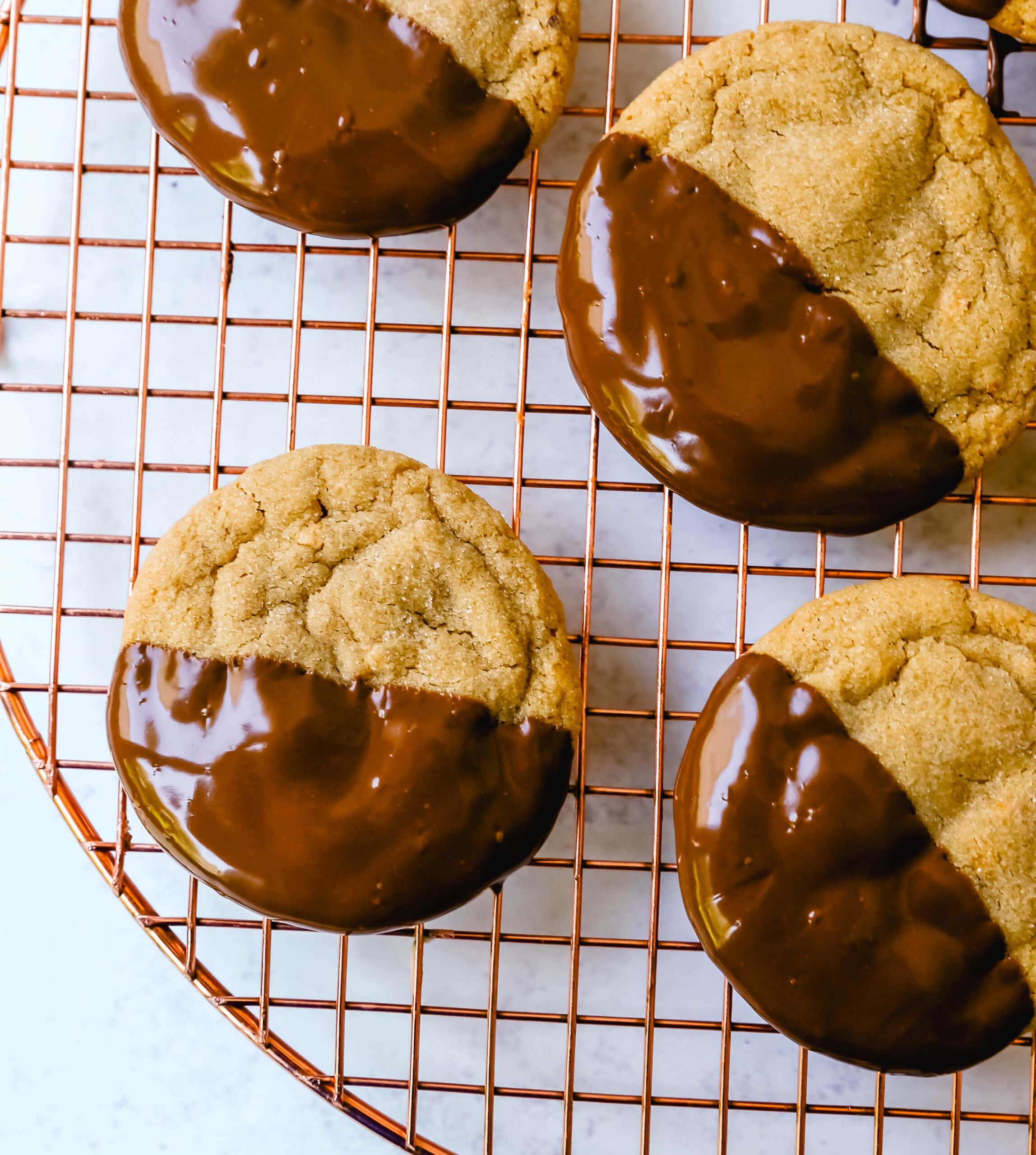 Soft, chewy homemade peanut butter cookies dipped in melted chocolate. This peanut butter and chocolate cookie is rich and decadent and perfect for chocolate peanut butter lovers!