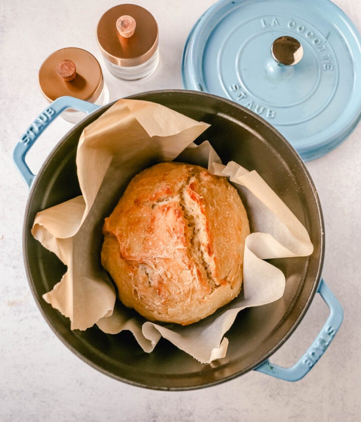 This No Knead Bread is baked in a dutch oven and is the perfect crusty french bread recipe. This makes a beautiful artisan loaf of bread and is so easy! The only ingredients you need are flour, water, salt, and yeast for the perfect overnight bread.