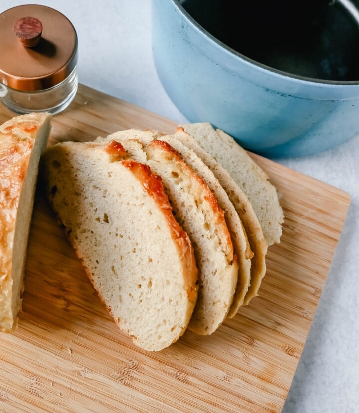 This No Knead Bread is baked in a dutch oven and is the perfect crusty french bread recipe. This makes a beautiful artisan loaf of bread and is so easy! The only ingredients you need are flour, water, salt, and yeast for the perfect overnight bread.