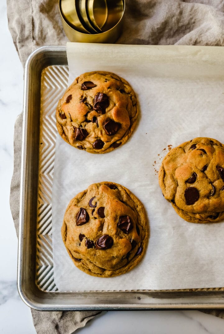 Soft, chewy Fall cookie with dark brown sugar, molasses, cinnamon, ginger, cloves, nutmeg, and chocolate chips for the perfect Autumn cookie. This is the perfect Fall spiced chocolate chip cookie recipe!