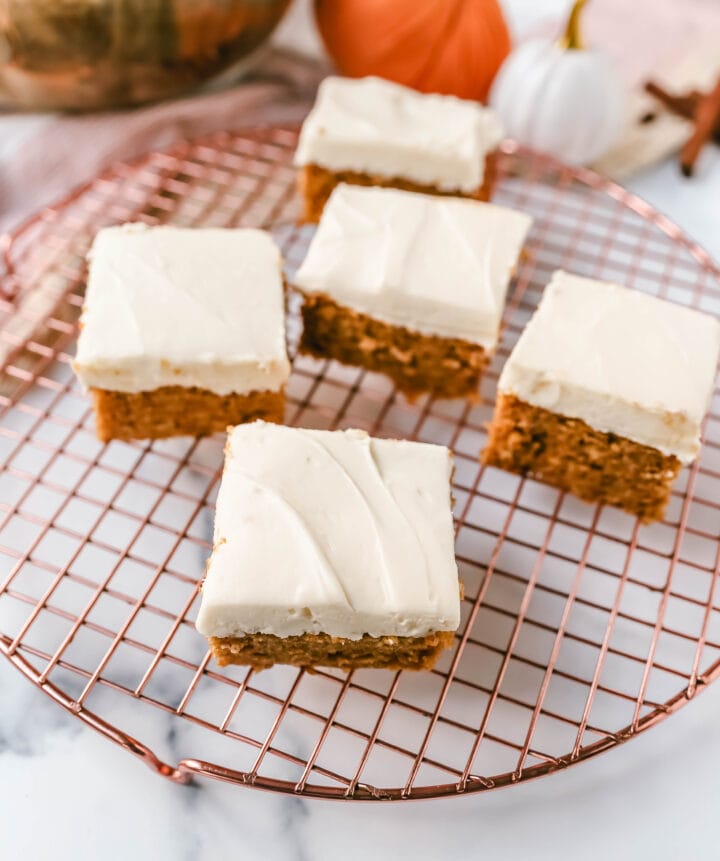 Pumpkin Bars with Cream Cheese Frosting are moist, pumpkin spiced bars topped with homemade sweet cream cheese frosting. The best pumpkin bar recipe!