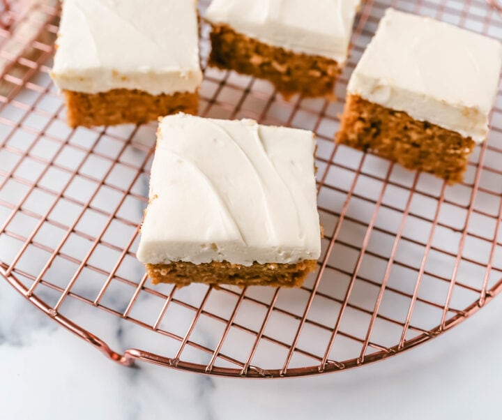 Pumpkin Bars with Cream Cheese Frosting are moist, pumpkin spiced bars topped with homemade sweet cream cheese frosting. The best pumpkin bar recipe!