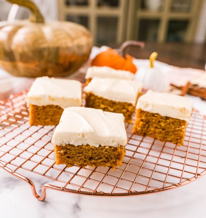 Pumpkin Bars with Cream Cheese Frosting are moist, pumpkin spiced bars topped with homemade sweet cream cheese frosting. The best pumpkin bar recipe!