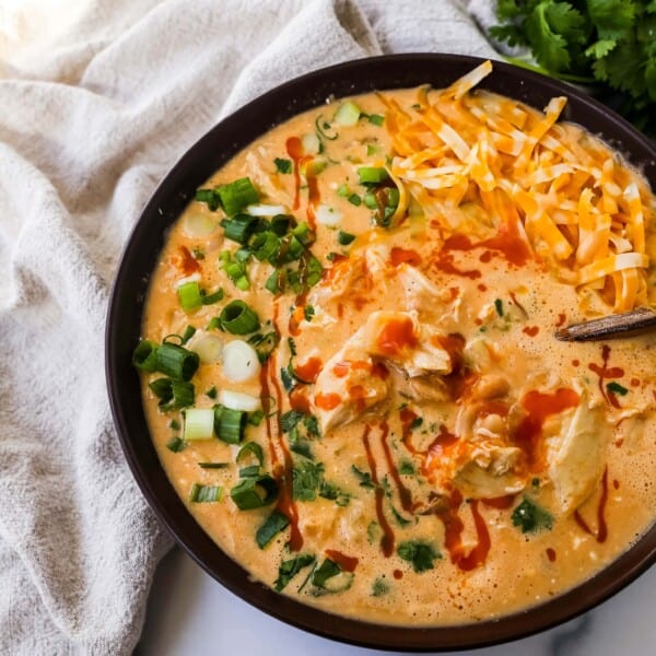 This Creamy Buffalo Chicken Chili is the perfect twist on a white chicken chili recipe. It is perfectly spiced, creamy, and has the right amount of tang. This will be your new favorite Buffalo white chicken chili recipe!