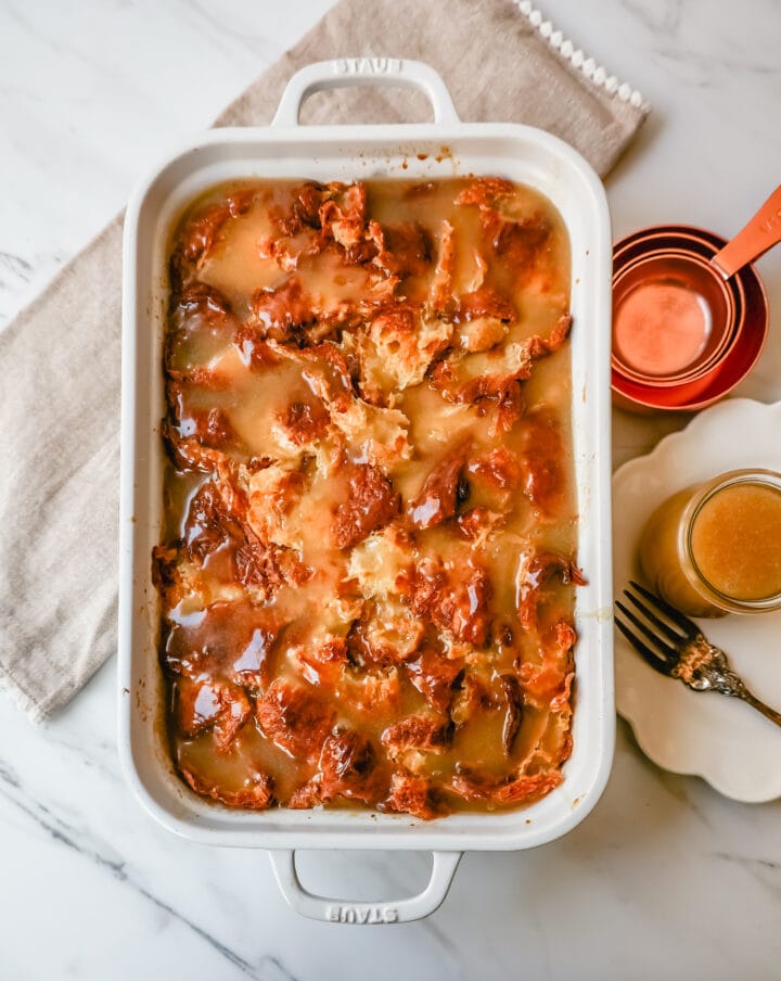  Croissant Bread Pudding with Vanilla Sauce is made with croissants baked in a custard sauce and topped with a homemade vanilla bean sauce. The most decadent dessert or breakfast recipe!