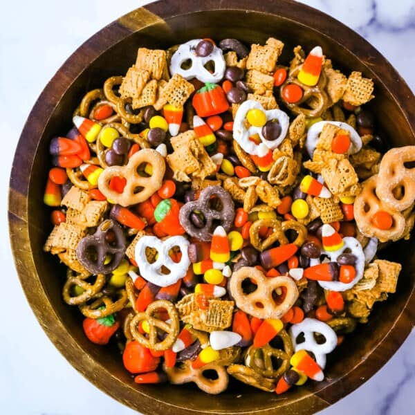 This Halloween Sweet and Salty Snack Mix is made with salty pretzels, butterscotch-tossed Chex cereal, candy corn, Reese's Pieces, and chocolate-covered pretzels. You can even add in some salty peanuts or caramel corn for a more salty and sweet combination. This is the perfect Fall sweet snack mix.