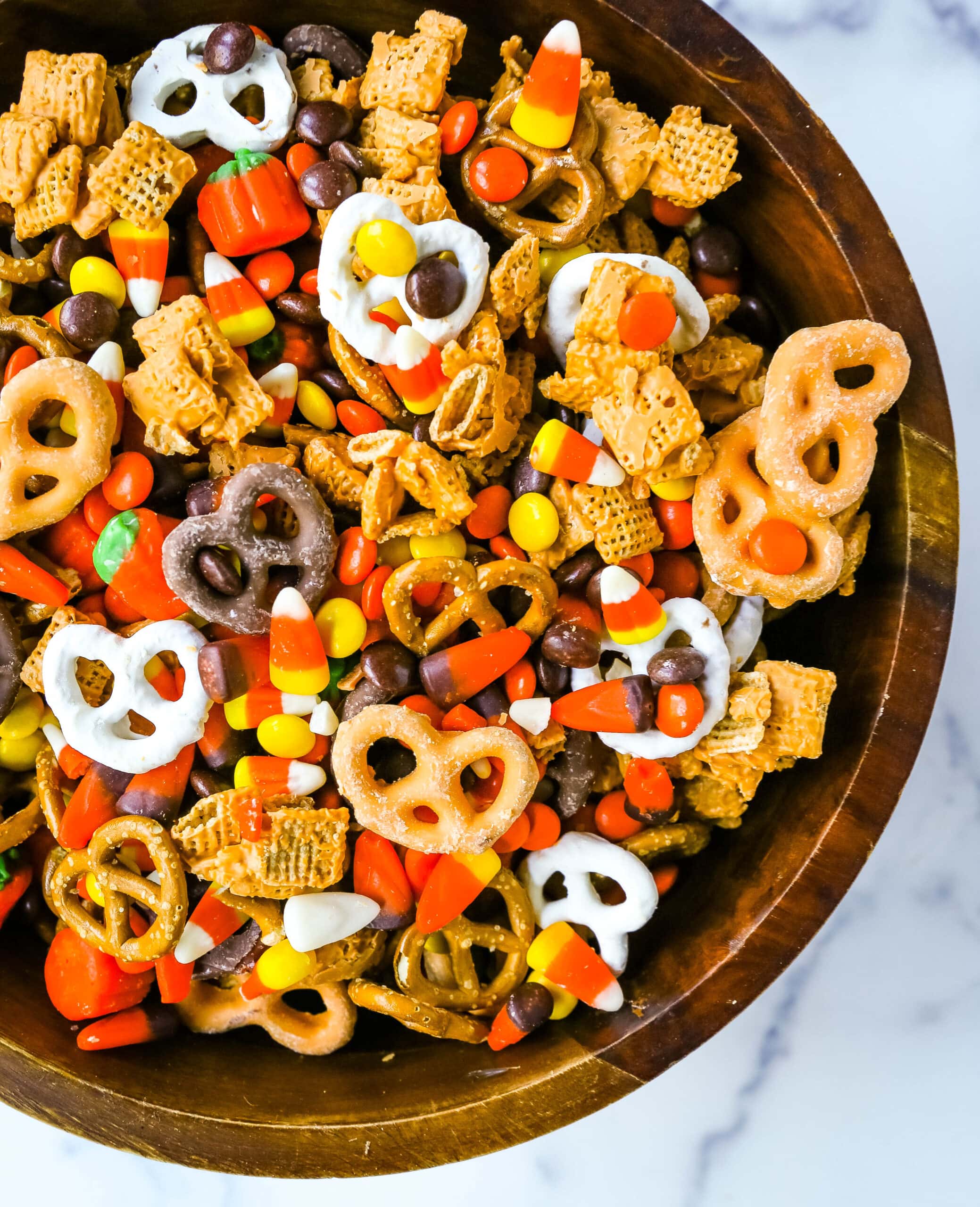 This Halloween Sweet and Salty Snack Mix is made with salty pretzels, butterscotch-tossed Chex cereal, candy corn, Reese's Pieces, and chocolate-covered pretzels. You can even add in some salty peanuts or caramel corn for a more salty and sweet combination. This is the perfect Fall sweet snack mix.