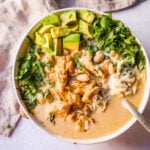 The Best White Chicken Chili Recipe made with shredded chicken, jalapeno, onion, spices, in a creamy chicken broth with salsa verde, cream cheese, white beans, shredded cheese, and fresh cilantro. The perfect creamy white chicken chili recipe!