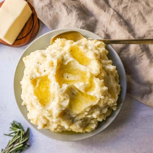 Creamy, Buttery Garlic Mashed Potatoes made with potatoes creamed with butter, garlic, mascarpone cheese, cream, and salt. The creamiest garlic mashed potatoes recipe!