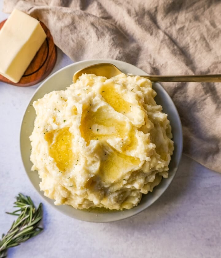 Creamy, Buttery Garlic Mashed Potatoes made with potatoes creamed with butter, garlic, mascarpone cheese, cream, and salt. The creamiest garlic mashed potatoes recipe!