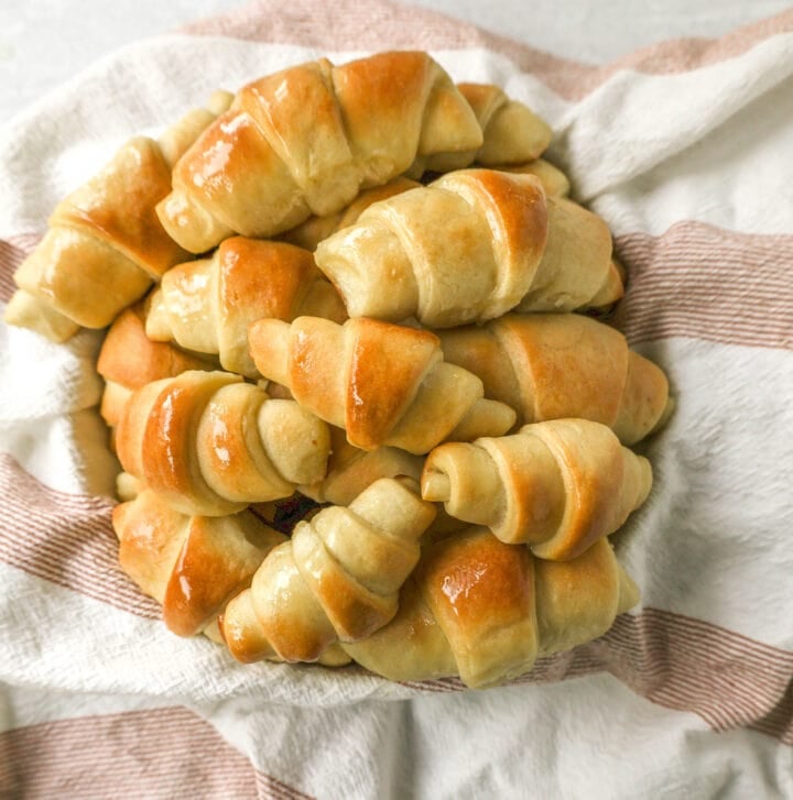 These Homemade Crescent Rolls are the most perfect buttery, light, and fluffy homemade roll recipe. Easy homemade rolls made from scratch!