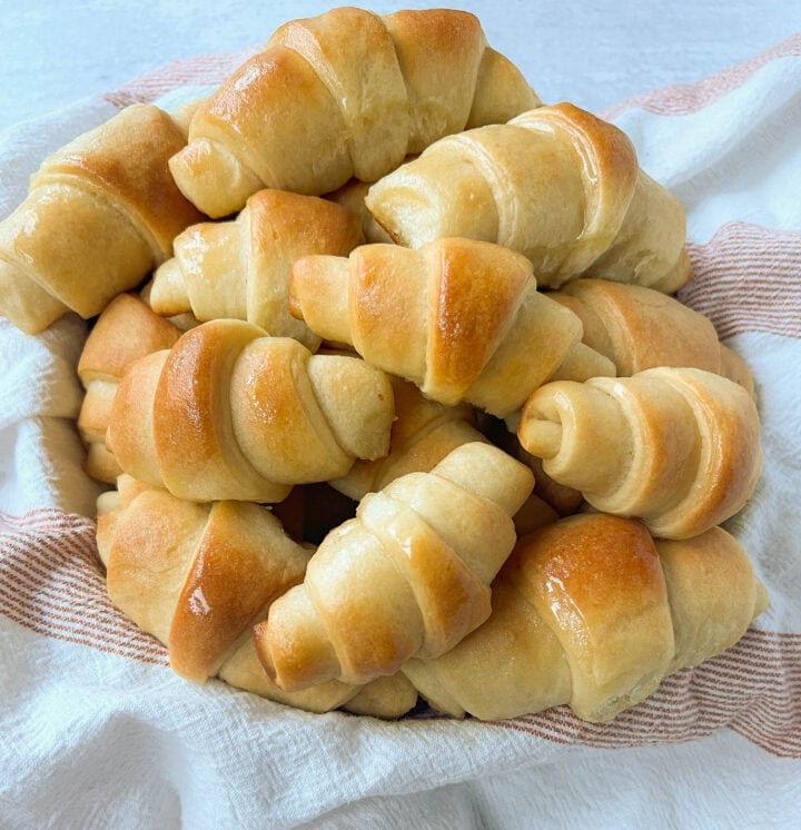 These Homemade Crescent Rolls are the most perfect buttery, light, and fluffy homemade roll recipe. Easy homemade rolls made from scratch!