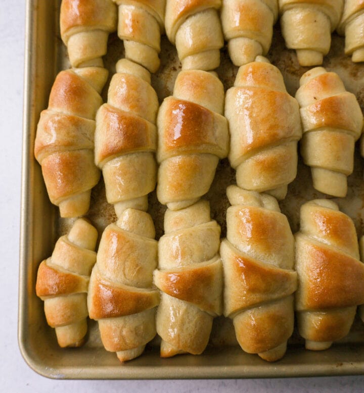 These Homemade Crescent Rolls are the most perfect buttery, light, and fluffy homemade roll recipe. Easy homemade rolls made from scratch!