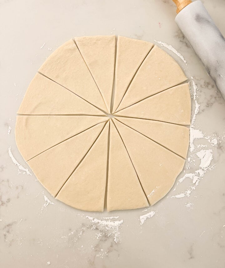 Rolling out crescent dough into 12 pieces. 