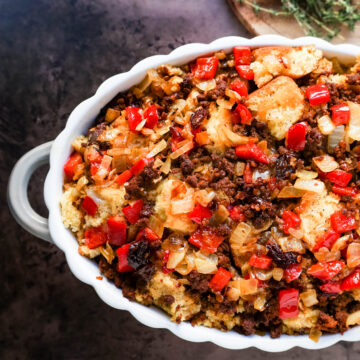 Mexican Chorizo Cornbread Stuffing made with cornbread tossed with sauteed peppers and onions, Mexican chorizo, chipotle peppers, chicken broth, cream, and spices. The most flavorful stuffing you will ever try!