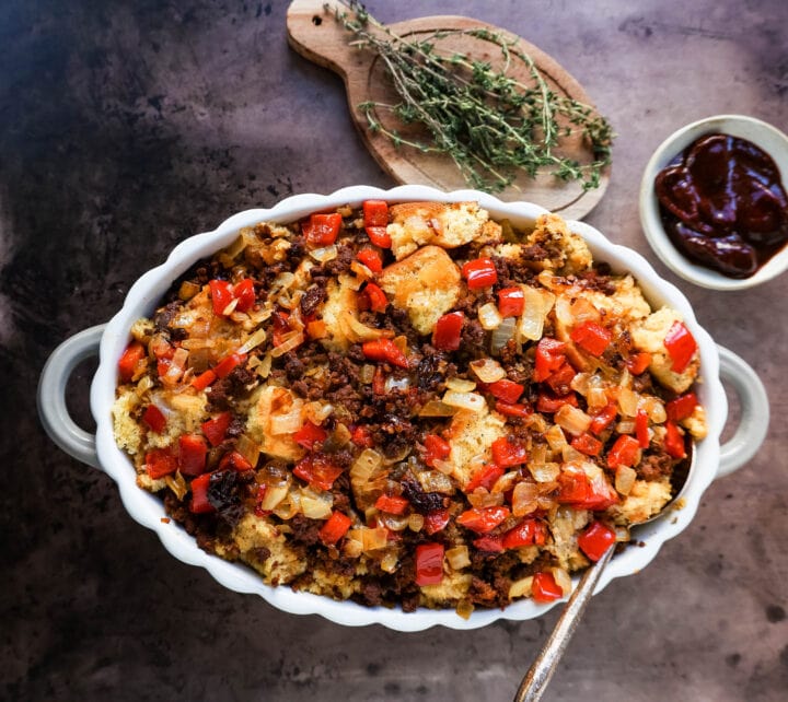 Mexican Chorizo Cornbread Stuffing made with cornbread tossed with sauteed peppers and onions, Mexican chorizo, chipotle peppers, chicken broth, cream, and spices. The most flavorful stuffing you will ever try!