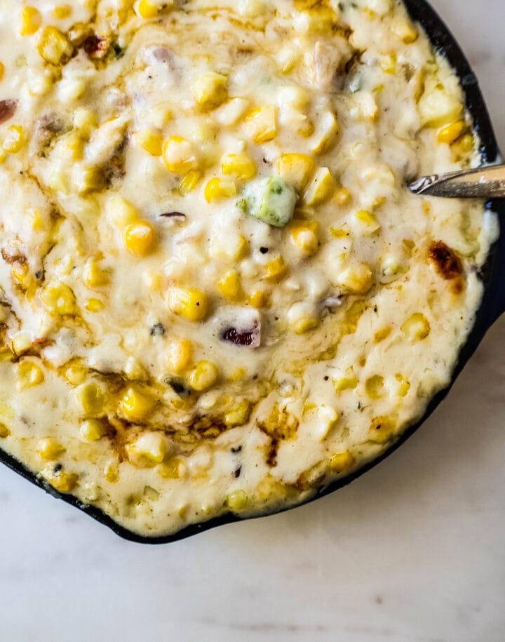 This Southwest Creamed Corn is made with white corn, sauteed with jalapenos and onions, and cooked with heavy cream and pepper jack cheese. The perfect creamed corn recipe with so much flavor!