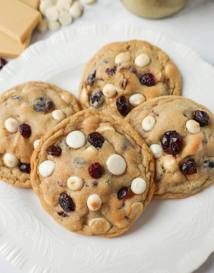 Soft Cranberry White Chocolate Chip Cookies are perfectly chewy with buttery crispy edges filled with sweet dried cranberries and creamy white chocolate chip chips. The Best White Chocolate Chip Cookie Recipe!