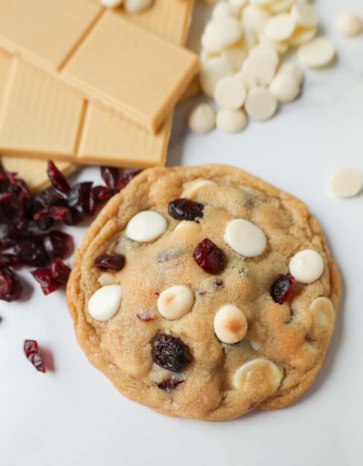 Soft Cranberry White Chocolate Chip Cookies are perfectly chewy with buttery crispy edges filled with sweet dried cranberries and creamy white chocolate chip chips. The Best White Chocolate Chip Cookie Recipe!