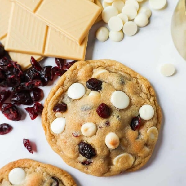 Soft Cranberry White Chocolate Chip Cookies are perfectly chewy with buttery crispy edges filled with sweet dried cranberries and creamy white chocolate chip chips. The Best White Chocolate Chip Cookie Recipe!